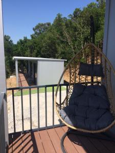 a swing on the balcony of a house at Quinta da Corujeira in Vila Real