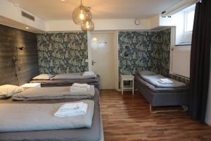 Postel nebo postele na pokoji v ubytování Lapland Lodge