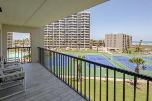 a balcony with a view of a tennis court at Saida in South Padre Island