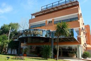 a building with a balcony on the side of it at Salto Grande Hotel in Punta del Este