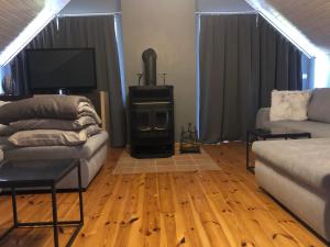 Posezení v ubytování Apartamenty Jarzębinowa 17