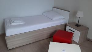 Postel nebo postele na pokoji v ubytování Apartmani Lara