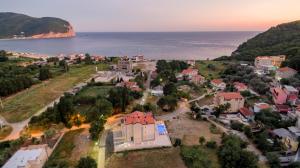 an aerial view of a town next to the ocean at Luxury Apartments Queen in Petrovac na Moru
