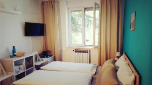 Postel nebo postele na pokoji v ubytování Villa Csipak