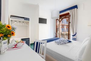 Ένα ή περισσότερα κρεβάτια σε δωμάτιο στο Hotel Herculaneum