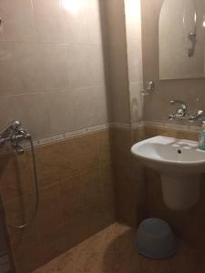 a bathroom with a shower and a sink at Къща за гости Aтанасов II in Primorsko +18 photos