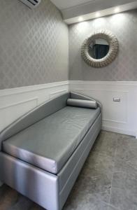 A bed or beds in a room at SILVER SUITE