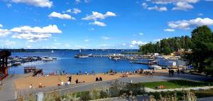 a group of people on a beach near a marina at APARTAMENT WILKASY II (k. Giżycka ) in Wilkasy