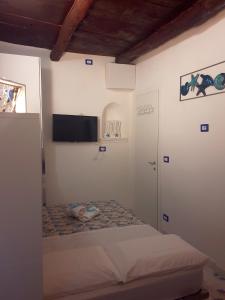 Posteľ alebo postele v izbe v ubytovaní La casa nella Torretta