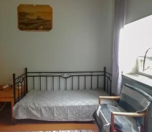 Postel nebo postele na pokoji v ubytování Vanhan Koulun Majatalo-Old School Guest House