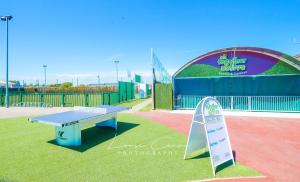 a ping pong table and a sign in a park at Sea 'n' Stars Platinum Plus Holiday home with Views, Free Wifi and Netflix in Camber