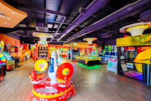 a room with many arcade games in it at Sea 'n' Stars Platinum Plus Holiday home with Views, Free Wifi and Netflix in Camber