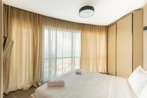 Postel nebo postele na pokoji v ubytování Orbi Sea Towers Hotel Official