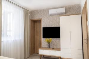 TV a/nebo společenská místnost v ubytování Casa PERLA