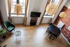 an overhead view of a living room with a table and chairs at RedCity LOFT 303 in Żyrardów
