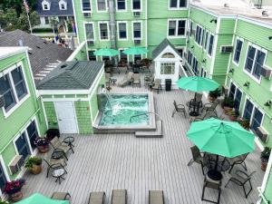 an overhead view of a patio with tables and umbrellas at Murray Hotel in Mackinac Island