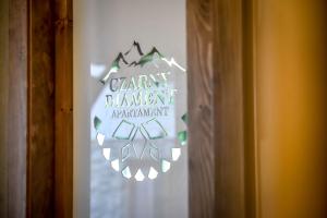 Certyfikat, podpis lub inny dokument wystawiony w obiekcie Czarny Diament Domek