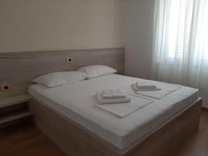 Postel nebo postele na pokoji v ubytování Apartments EDO