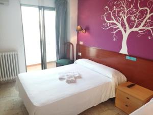 Postel nebo postele na pokoji v ubytování Hostal Jaime I
