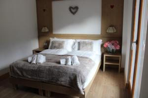 Un pat sau paturi într-o cameră la Residence Panorama