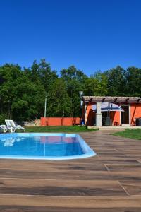 an empty swimming pool in the middle of a parking lot at House in nature in Tinjan