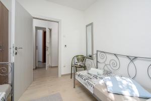 Cama o camas de una habitación en Apartment Fiori