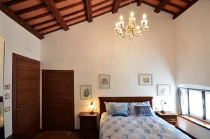 Postel nebo postele na pokoji v ubytování Al Castello di Aiello