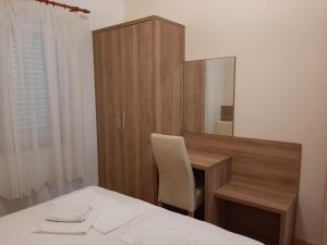 Postel nebo postele na pokoji v ubytování Apartments EDO