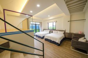 En eller flere senger på et rom på 渡小夜電梯民宿 Yilannight B&B