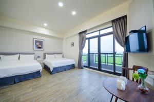 En eller flere senger på et rom på 渡小夜電梯民宿 Yilannight B&B