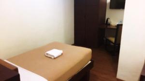 Letto o letti in una camera di Tacloban Plaza Hotel