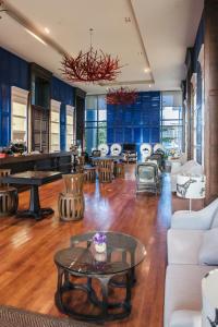 a large living room with a table and chairs at Amari Hua Hin in Hua Hin