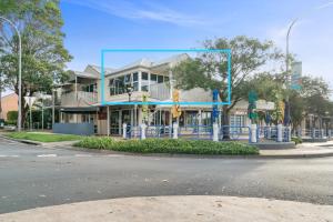 a building on the corner of a street at Secret at Huskisson in Huskisson