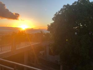 a view of the sunset from the balcony of a house at Chez Antonin in Bouillante