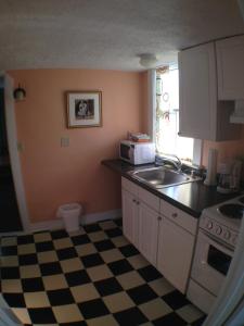 a kitchen with a sink and a stove at Lantana House in Rockport +39 photos