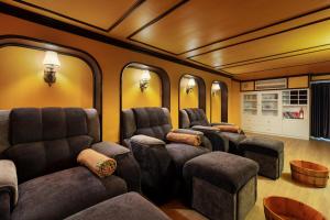 a train car room with chairs and tables at Minerva Church Hotel in Hanoi