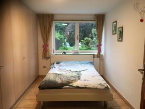 a bedroom with a bed with a picture of a deer at Naturforsthaus Ferienwohnung für Hunde- und tierverbundene Menschen in Preitenegg