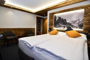 Postel nebo postele na pokoji v ubytování Hotel Elite