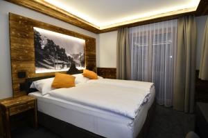 Postel nebo postele na pokoji v ubytování Hotel Elite