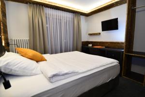 Postel nebo postele na pokoji v ubytování Hotel Elite