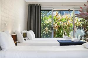 Ένα ή περισσότερα κρεβάτια σε δωμάτιο στο The Park Hotel Motel, Suffolk Park