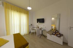 TV a/nebo společenská místnost v ubytování Al Settimo Piano