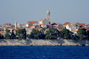a view of a city from the water at Guest House Dijana in Korčula