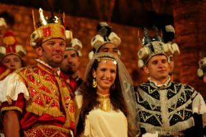 a bride and groom in crowns and a group of people at Guest House Dijana in Korčula