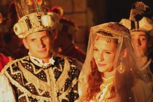 a bride and groom dressed up in wedding attire at Guest House Dijana in Korčula