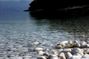 a group of rocks on a beach near the water at Guest House Dijana in Korčula