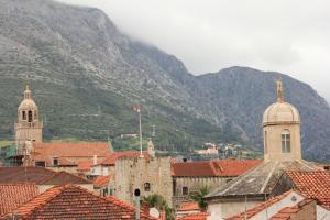 a view of a town with mountains in the background at Guest House Dijana in Korčula