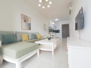 a living room with a couch and a table at The Elysia Park Residence by Home Owner in Johor Bahru