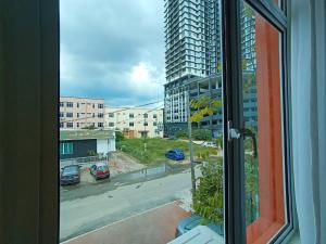 a view of a city street from a window at W Hotel Cemerlang in Kota Bharu