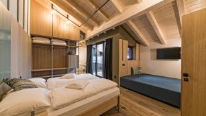 Ένα ή περισσότερα κρεβάτια σε δωμάτιο στο Hotel Villa Mayr Rooms & Suites